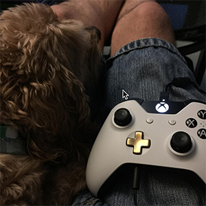 Brian With His Dog Playing Xbox